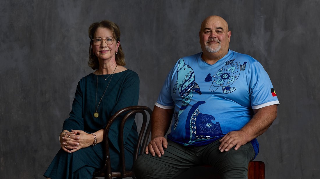 Two people sitting on two different chairs